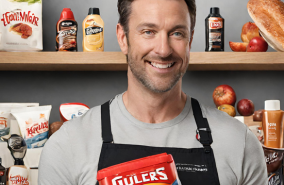 A man poses with a product in a commercial